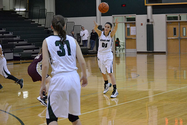 Junior Rachel Pokorney passes the ball to senior Tahlea Holst during the Dripping Springs game on Dec. 13, which CP won 54-34. Photo by Sabrina Lee.