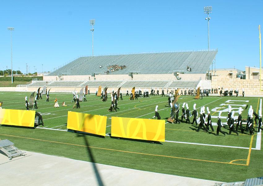 The band sets up props for their performance at The Festival of Bands at Gupton Stadium on Sept. 22. The Festival helped raise money for charity while judges rate the bands from different schools on their overall performance. “The Festival is more of a show,” Driskill said. “It’s all about how your performance looks and whether or not the show comes together.”
