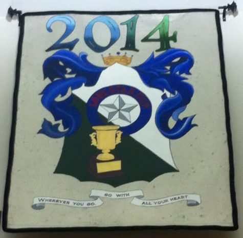 The school's crest flags hang on the upper walls of the library.