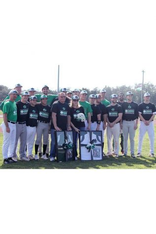 The alumni game participants pose with the parents of Matt Arellano.
