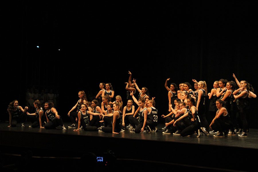 After they performed their hip hop routine, Ballin, The Celebrities pose for the ending of their team dance on Oct. 8 at iDance at Leander High School. They performed two team dances, two officer dances and had the seniors perform in the senior dance at the finale. I’m going to come to iDance next year, senior and Captain Mackenzie Lawrence said. I hope that the dances continue to be just as good as they were this year. It was super strong this year and a great last iDance for me, and I hope that next year they feel the same way.