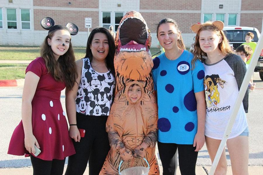The favored dinosaur costume posing with CP students. 