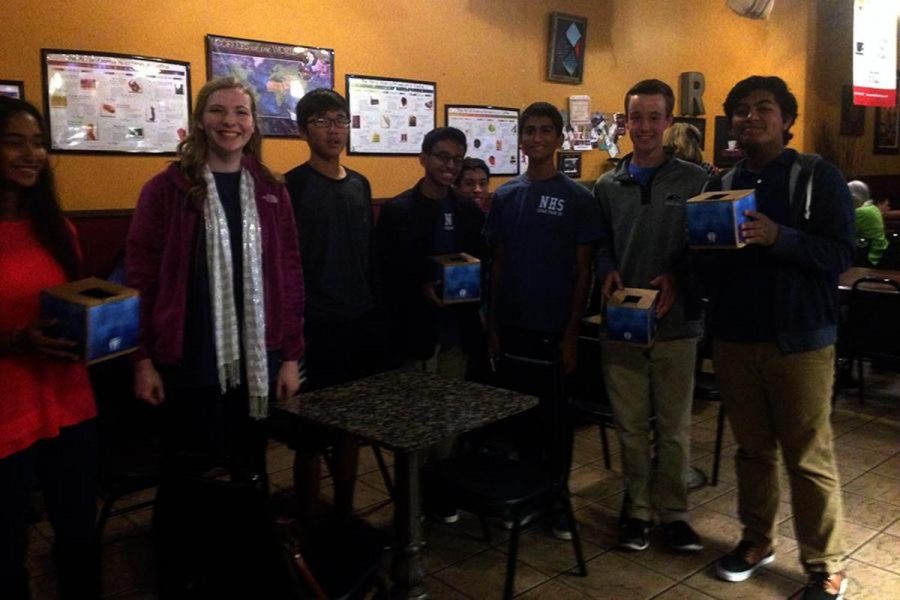 NHS members carrying donation boxes gather around for a picture at the Roasters fundraiser. On Wed. Dec. 9 NHS raised $80 for the Basdrop fire relief efforts. It was great to see all of the people who came out, senior NHS vice president Claire Cantrell said. Roasters is such an intimate space that makes it seem more personal.  