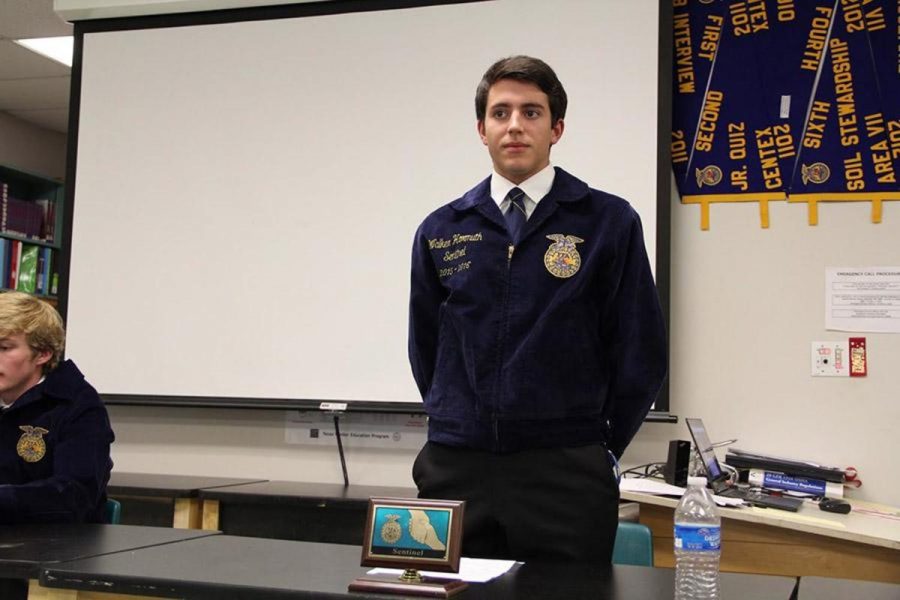 Senior Walker Hormuth stands before a FFA meeting earlier this year. Hormuth ran for a district office position this year. “Even though I didn’t get elected to a position, just standing on stage with the bright lights in my face, I was surprised I even got up there,” Hormuth said. Next fall, Hormuth plans to attend Tarleton State University and to join collegiate FFA.
