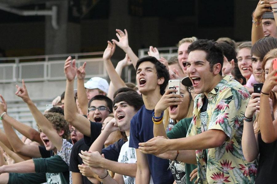 Student section leader Ben Prasifka cheering on CPFB at the Aledo game on Aug. 28. I just showed up to a game and kind of became student section leader, Prasifka said. I just really like football and decided last year that I wanted to be the leader. 