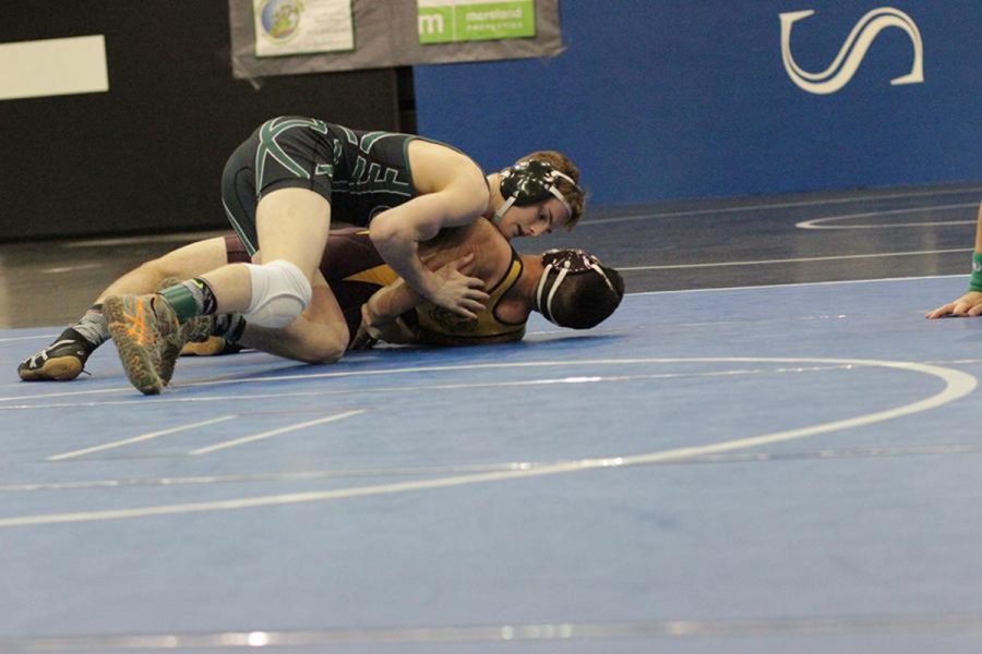 Mason Vidrine fights to win his match at the District tournament, I go out to my matches knowing that I put in more work than my opponent, Vidrine said. And that I am more prepared for the match at hand.