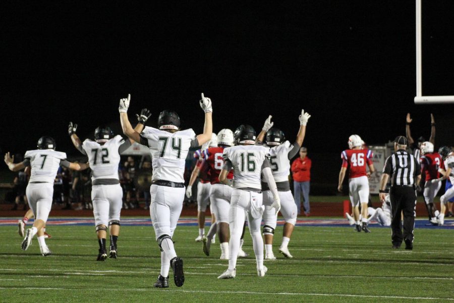 Hands go up as junior Mason Brooks and teammates celebrate a touchdown in the 43-13 win over Waco Midway on Aug. 26. 