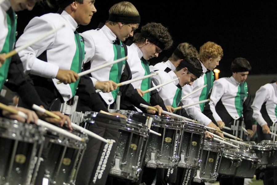 On+beat%2C+the+drumline+performs+under+the+Gupton+Stadium+lights.+This+year%2C+competition+at+the+Lonestar+Classic+for+the+drumline+looked+different+due+to+COVID+restrictions.+We+had+to+adapt+to+make+our+performance+work+this+year+more+than+ever%2C+Thompson+said.+Nevertheless+they+still+managed+to+pull+a+first+place+victory.