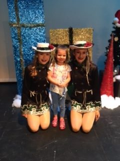 Sophomore Celebrities Kelsey McFarland and Lauren Allen with Ashley Peterson (center) at the Celebrities Holiday Showcase.