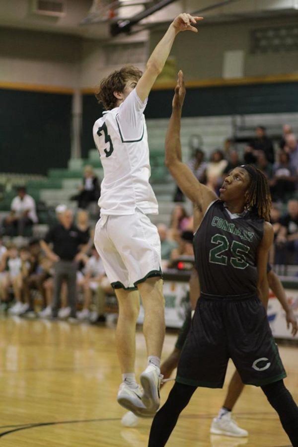 Junior Eric Weeks hits a buzzer-beater to beat Connally on Feb. 7 at the Timberdome