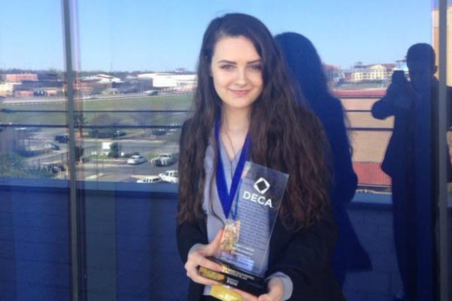 Senior Avery Daniel holding her award that allows her to advance on to Internationals in DECA.
I have been in DECA since freshman year, Daniel said. I have been competing since sophomore year so to have finally have made it has been really rewarding.