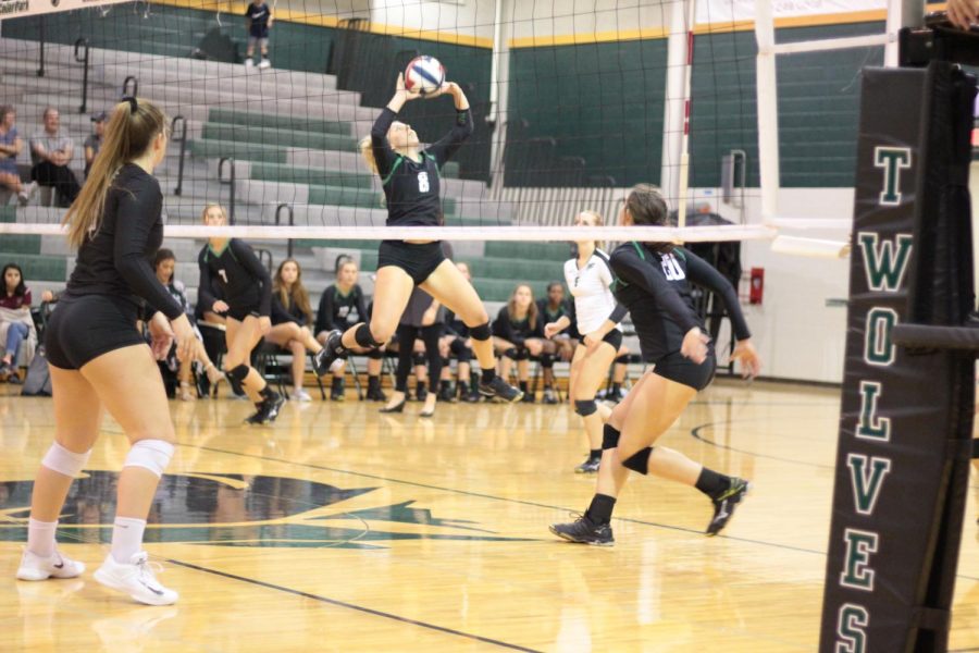 Junior Laurel Foster sets the ball to a teammate in the second sets against Rouse on Sept. 22.