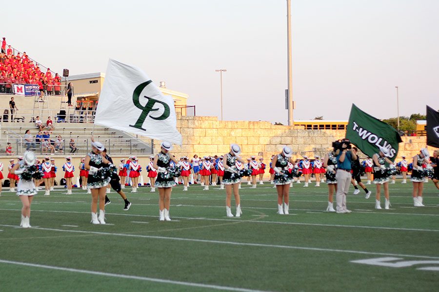 Flag Runners lead the football team out of the bust out on Sept. 1 to start the 2017 season.