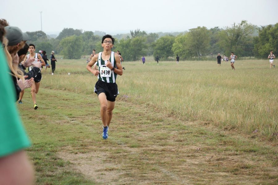 Varsity+cross+country+runner+Alden+Yi+races+in+the+district+meet+on+Saturday%2C+Oct.+14.