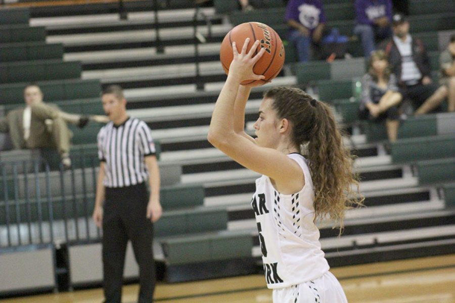 Senior Kilee West passes the ball at their first game of the season against Hutto on Nov. 28. 