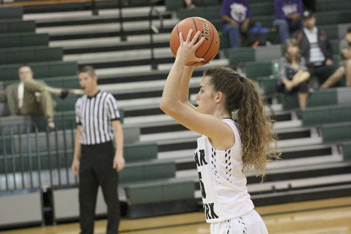 Senior Kilee West passes the ball at their first game of the season against Hutto on Nov. 28.