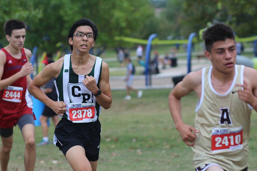 Competing+at+the+state+meet+on+Nov.+4+at+Old+Settlers+Park%2C+junior+Alden+Yi+works+hard+to+finish+the+race.+Yi+was+one+of+the+members+of+the+Varsity+boys+team+that+placed+3rd+overall.