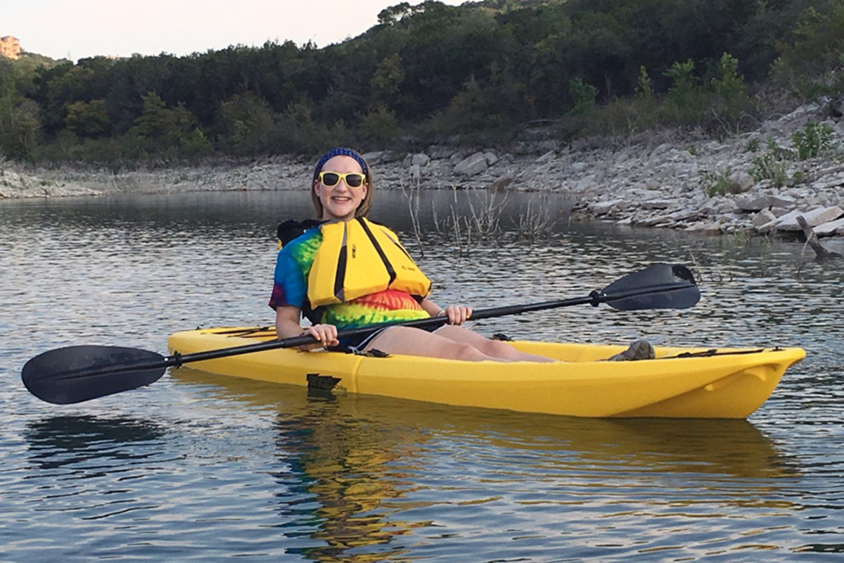 Paddling in a kayak, sophomore Kira Niedert stays positive. She had just come to terms with having cancer.