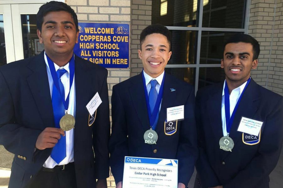 Advancing to state for Independent Business Plan, seniors Gegory Phea, Shiva Kumar and Rithvik Saravanan stand with their medals. 