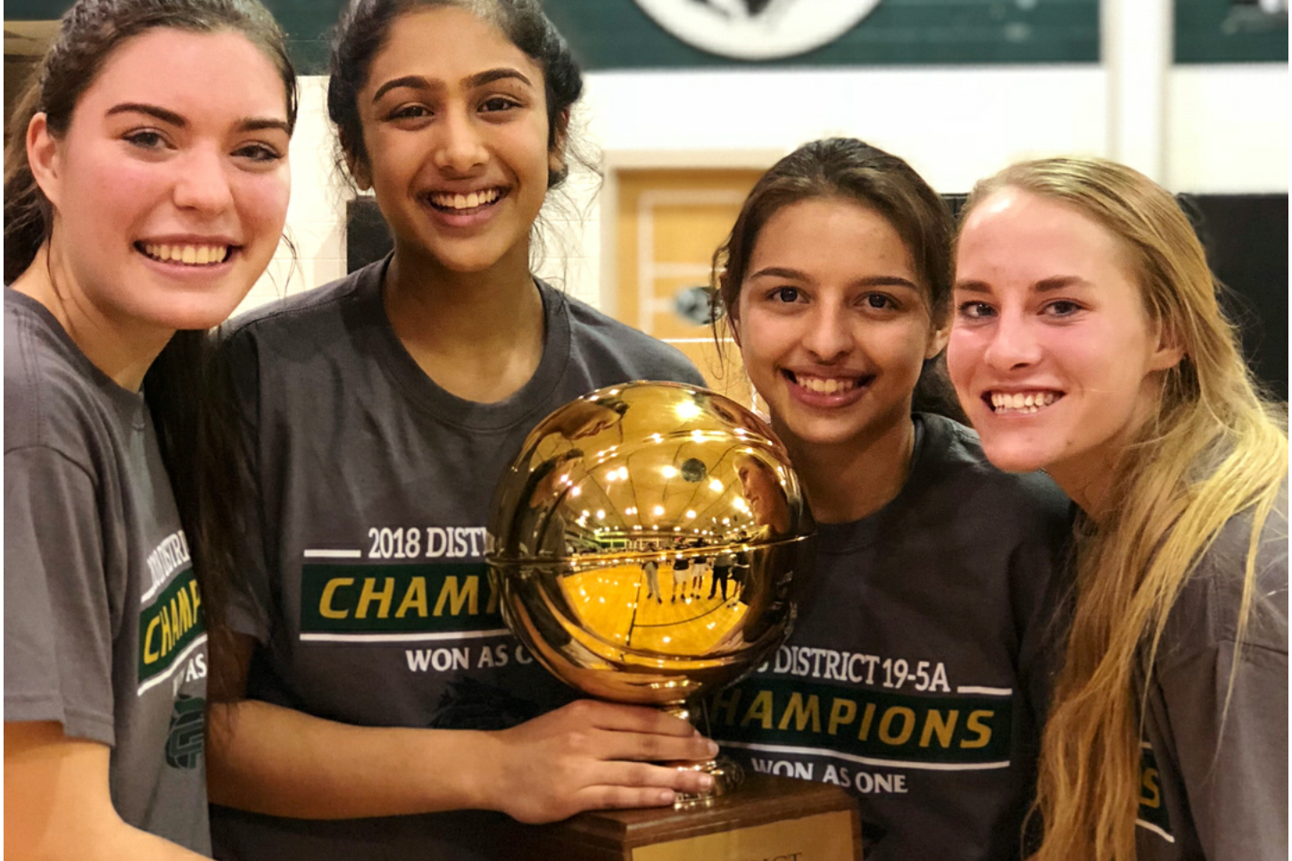 Junior Pujita Shukla celebrates with her teammates senior Annie Callahan and Kalee West and freshman Sarai Estupiñan after winning outright district championship on Feb. 6.