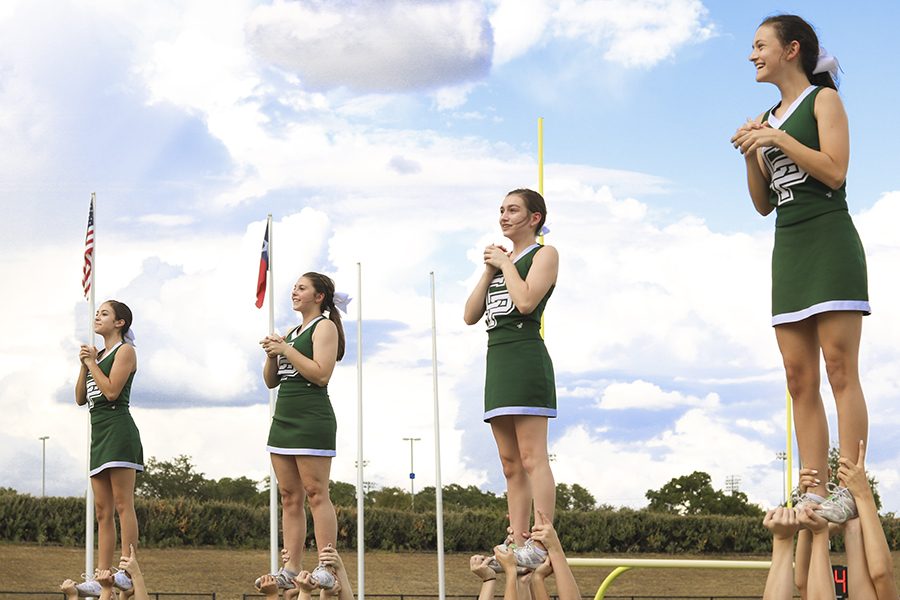 JV cheer team pumps up the student section at the Cedar Ridge JV football game on Sept. 6.