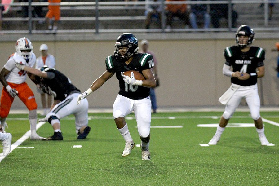 Junior running back Jonathan Stockwell looks for an opening against San Angelo on Sept. 14 at Gupton. Stockwell scored his first rushing touchdown during the first quarter. It was my first touchdown ever on varsity, Stockwell said. It was a new feeling Ive never felt before. It was electrifying just looking at everyone.