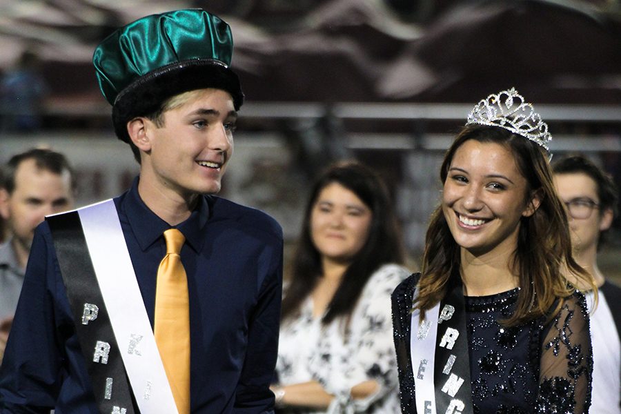 Senior Riley Pangilinan joins senior Dalton Hartmann as they were crowned homecoming king and queen on Sept. 29 at Gupton Stadium.