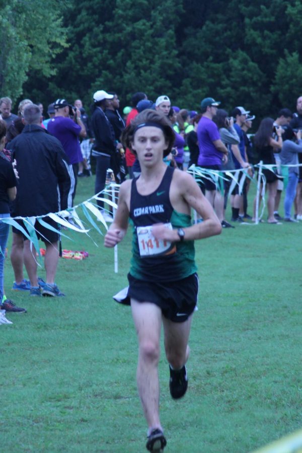 Racing to the finish, junior runner Owen Daugherty looks to finish the CP Invitational strong. He ended up placing 8th overall in the race. Ive been able to progress a lot this year, Daugherty said. Its been fun to have the team supporting each other.
