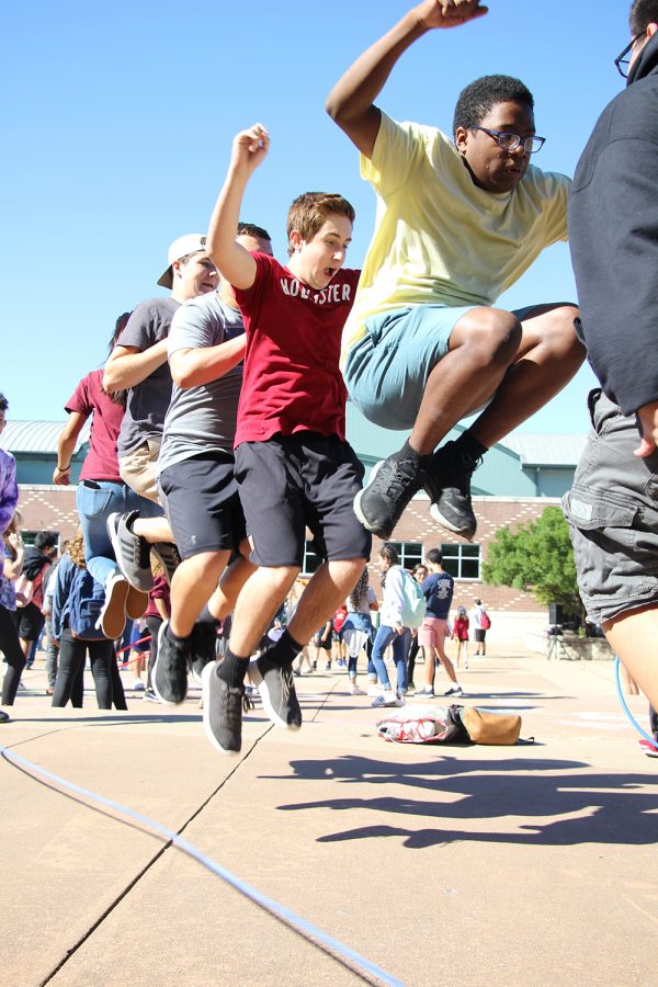 Jumping together, freshmen Caleb Coleman, Ryder Lucero, Zolan Barrett and several other students spend the afternoon in the courtyard on Oct. 10 after the PSAT. The P.A.C.K. Club hosted their first PACKtivity, “Fall Fest,” which included a cake walk, pumpkin painting, soda ring toss and jump rope. “I appreciated the PACKtivity because it gave us a break and brought us together,” Lucero said. “I liked the jump rope because all of my friends were there, along with some football players, and we were all jumping together like a team.”
