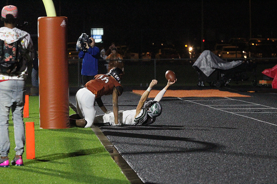Senior Brandon Breed celebrates a touchdown after making a tough catch in the end zone during the Oct. 19 Hutto game. Breed had a solid game with one touchdown and a good amount of catches.