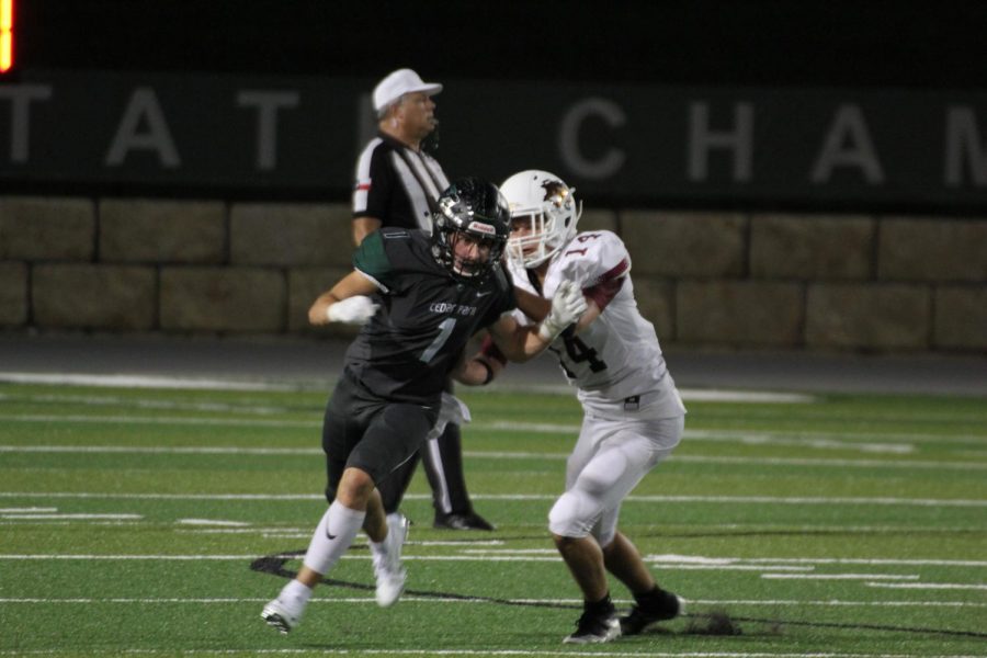 Senior WR Carson Neel runs a route in the homecoming game against Rouse.