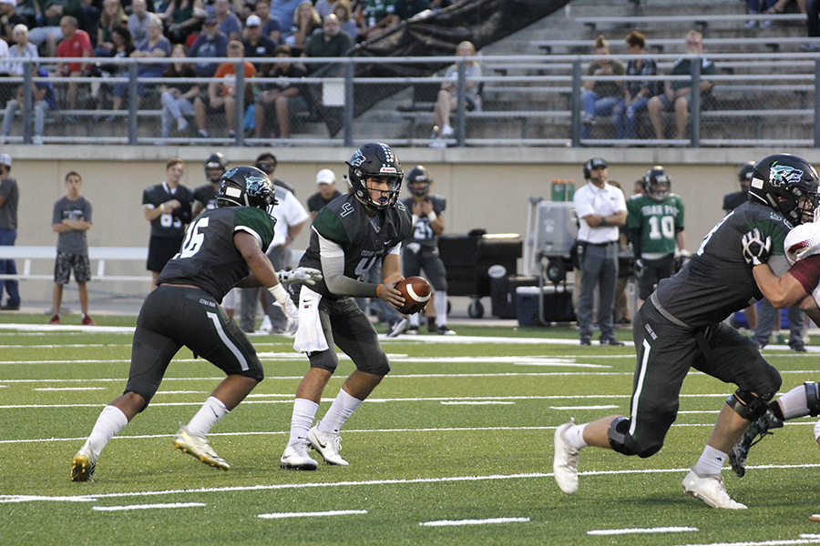 Sophomore QB Ryder Hernandez reads the defense during a run-pass option play 9/28 against Rouse.