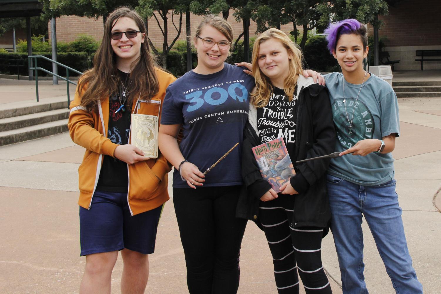 Club president senior Patrick Engle and junior Loree Morin posing with two other club members during their meeting after school on Monday, October 22nd. Morin joined the Harry Potter club at the beginning of this year.