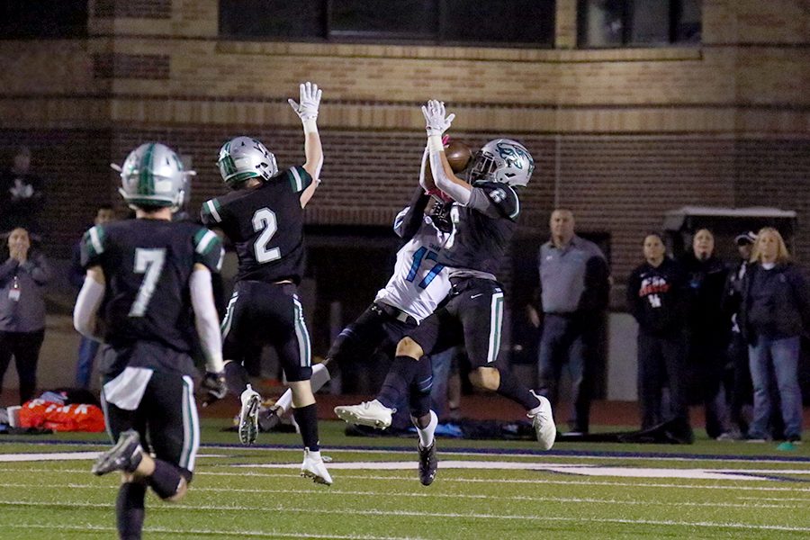 Leaping up, junior safety Tammer Alzer intercepts a pass against Shadow Creek on Nov. 23. The Timberwolves lost to the Sharks 21-14. The [interceptions] were planned throughout the film we watched from them, Alzer said. We knew the quarterbacks tendencies and the coaches put me in a position to make a play.