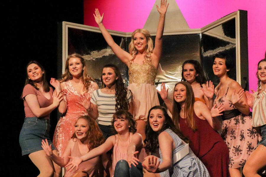 Junior Lindsay Dove, portraying Elle Woods, is surrounded by her Greek chorus as the final notes of Omigod You Guys sound. Dove and the chorus were able to keep the audience engaged and set the lively tone for the entire show with this opening song.
