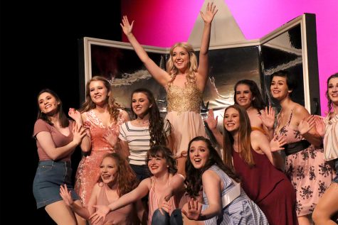 Junior Lindsay Dove, portraying Elle Woods, is surrounded by her Greek chorus as the final notes of