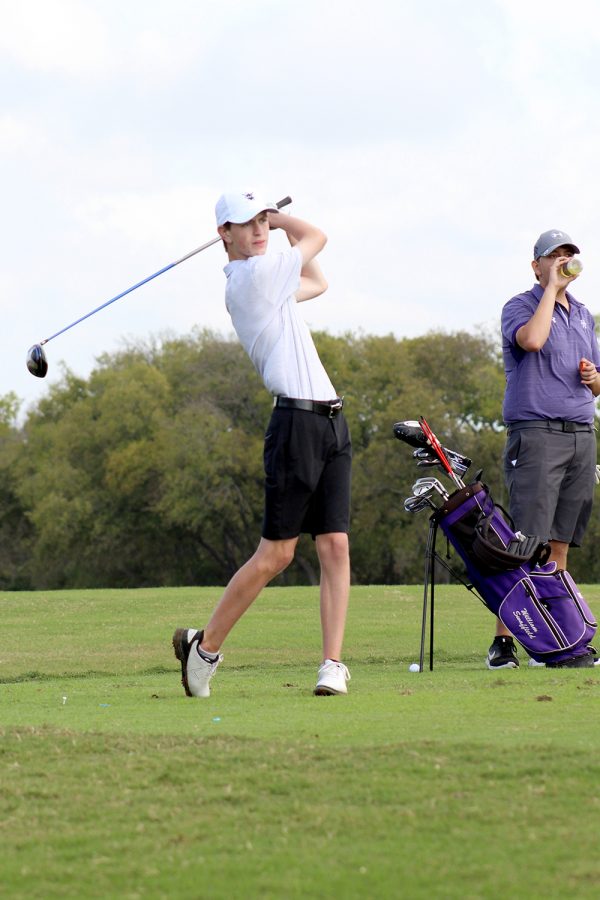Whipping out the driver, sophomore golfer Connor Wagner watches his ball sail across the green at Sydney Star Ranch on Oct. 30. “I’ve enjoyed [golf] since a young age, ever since my dad got me into it,” Wagner said. “It’s fun a lot of the time.”
