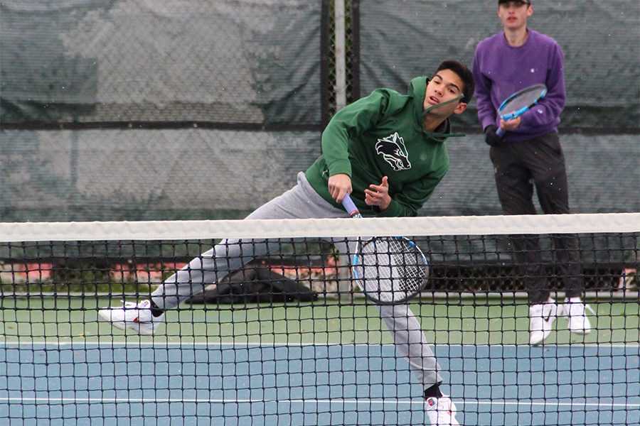 Junior Bryce Bailey hits a net shot during the Georgetown tournament on on Feb. 8. College tennis is extremely competitive in the sense that if youre a college tennis player, you could be competing against someone who is already [at a] professional level, Bailey said.