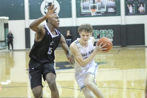 Boys Basketball Wins District, Moves On To Playoffs