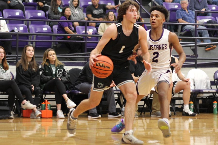 Senior guard Zach Herboek drives to the lane against Marble Falls on Feb. 8. My favorite part [of this season] was winning district and seeing all the hard work pay off, Herboek said.