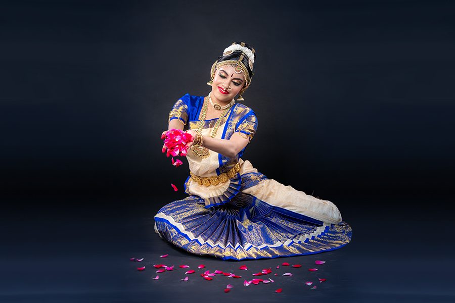 Pouring flowers to serve as a peace offering to God, senior Himaani Ramesh showcases a dance posture that she will use in her debut Bharatanatyam graduation, known as an Arangetram, on July 7. “I’ve always wanted to do an arangetram because I’ve always felt that it was an amazing accomplishment,” Ramesh said. “As I’ve set upon this journey it’s been very humbling because I’ve realized that there will always be room for growth and improvement, and that’s what dance is really all about.