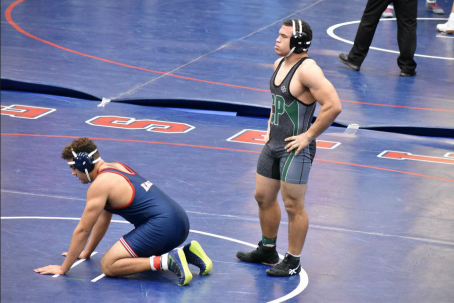 Munoz prepares for a match against a wrestler from Allen High School during the Allen Outlaw Tournament on Jan. 1-2. After being a member of the football and wrestling teams for four years, Munoz will be pursuing an engineering degree at Trinity University this fall.