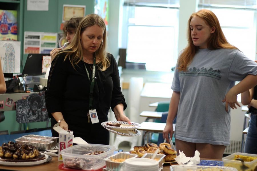 French teacher, Tammy Nettles and freshman Meredith Jenkins hover over the selection of courses, as Nettles instructs the class. Jenkins baked the palmiers and said that a part from getting the baking time right, the process of making them was easy. I really enjoyed this project because it was exciting to immerse myself into the cuisine of france, Jenkins said. 