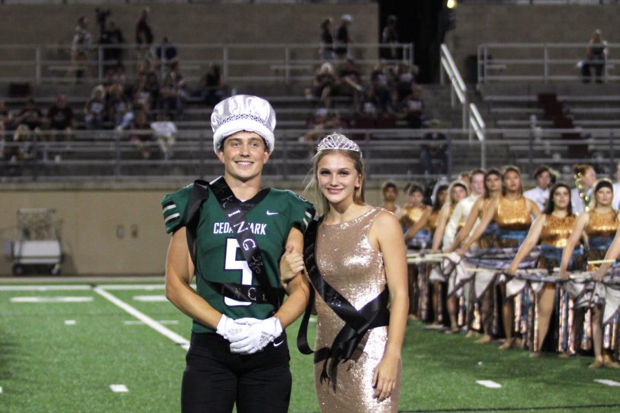 Posing together, seniors Majeston Haverda and Grayson Moore accept their crowning as homecoming king and queen on Sept. 20. Both Haverda and Moore said they were grateful for the opportunity their fellow peers granted them. Its been really fun, its an honor, I just appreciate everyone who voted for me and made this happen, Haverda said. 
