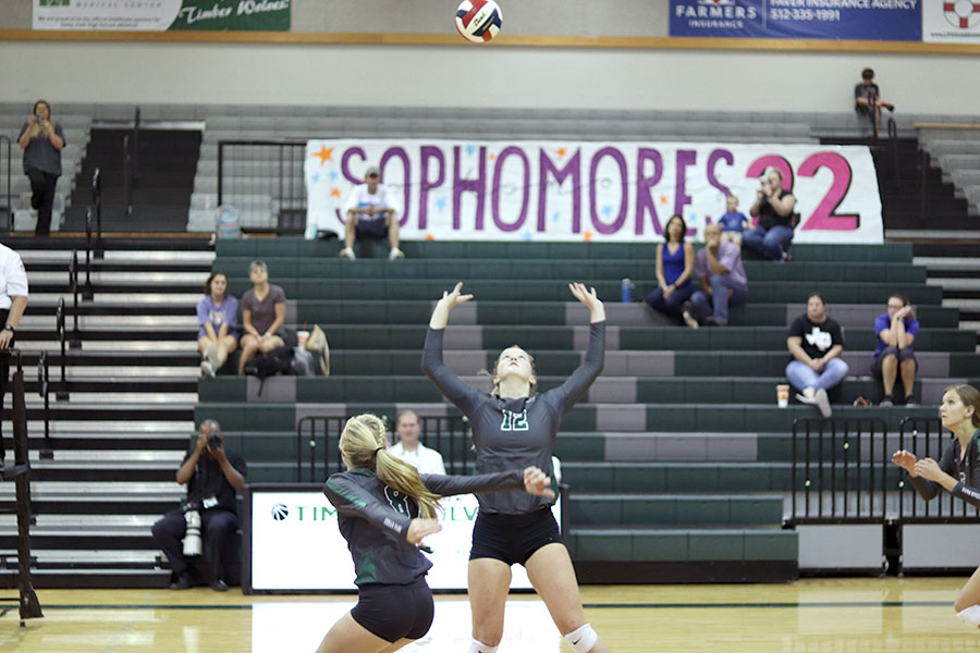 Senior Olivia Meyer sets the ball in a game on Aug. 22 at the volleypalooza at Cedar Park. After going through a terrible injury that had hindered her participation in the sport since eighth grade, Meyer recently returned to playing the sport she loves.  I want to make the most of every moment with my team and coaches, Meyer said. I also want to ensure the district champion title in order to help us become successful once playoffs come around. With an amazing coaching staff and a heart to win, I truly believe that this team is capable of exceeding the limits and taking this program to the next level this season.