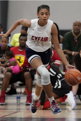 Freshman Gisella Maul dribbles down the cpurt during a select basketball league game. Maul made varsity basketball and is currently ranked second in Texas for the class of 2023. Number two is really high and I'm honored to be chosen, but I'm still working to get the top spot and I use that as motivation to keep working hard.