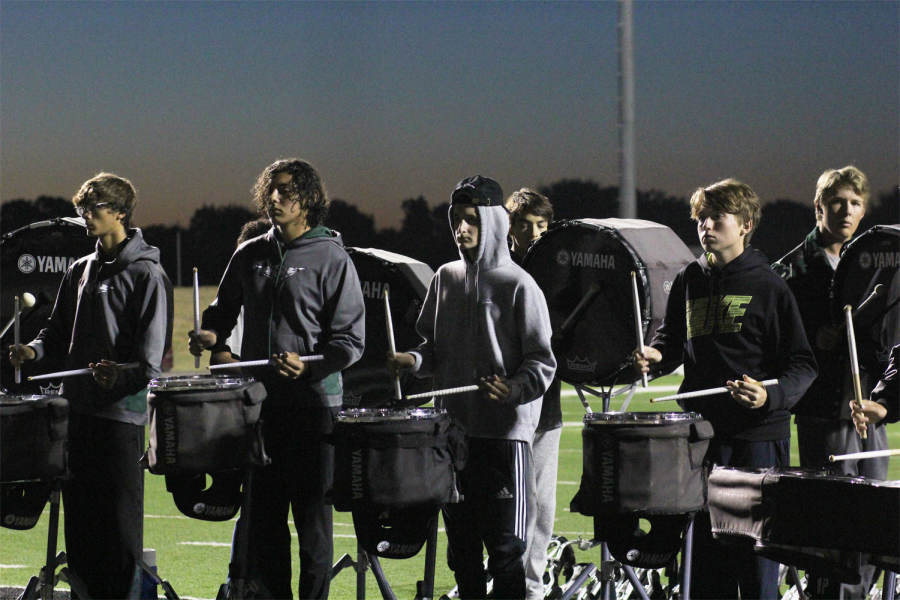The drumline practices their routine prior to the Hutto game.