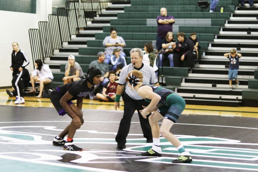 Freshman+wrestler+JJ+Lovell+gets+ready+to+take+on+an+opponent+during+the+Capital+Classic+Tournament+on+Nov.+22-23.+This+was+the+third+tournament+of+the+season+for+the+wrestling+team%2C+with+five+members+earning+top+ranks%2C+and+senior+captain+Cassie+King+named+Capital+Classic+Varsity+Girls+110lb+Champion.+%E2%80%9CAfter+I+won%2C+getting+my+hand+raised+was+one+of+the+best+feelings+because+winning+a+tournament+against+25+other+girls+just+shows+finally+how+much+work+I%E2%80%99ve+been+putting+into+this+sport+by+dieting+well%2C+training+hard+and+constantly+staying+disciplined%2C%E2%80%9D+King+said.+%E2%80%9CI+ran+and+gave+my+coach+a+hug+%5Bafter+the+match%5D+because+without+him+I+wouldn%E2%80%99t+have+gotten+this+far.