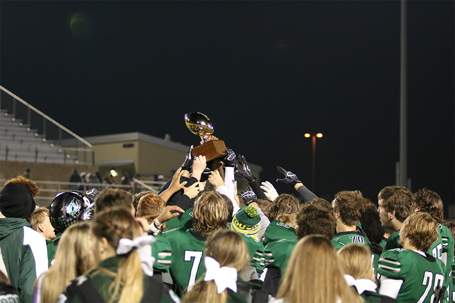 The T-Wolves hoist the district  champions trophy after officially clinching the outright title. The Wolves "Took It Back" this season and will now head to the playoffs. "Our goal was to take it back and we did just that," QB Hernandez said.