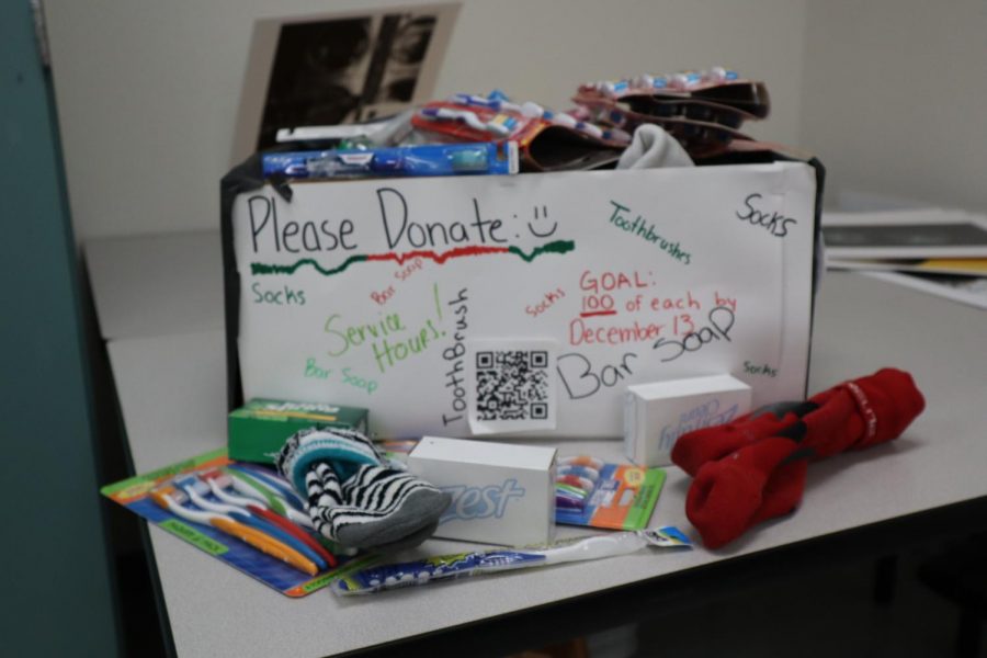 The box used to collect items for the drive. this was desigmned by every member of the club according to Shipps and there were several prototypes as well. We have all grown super close. Carter said.  I feel that we have gotten to know each other much better and as a result we are much stronger.
